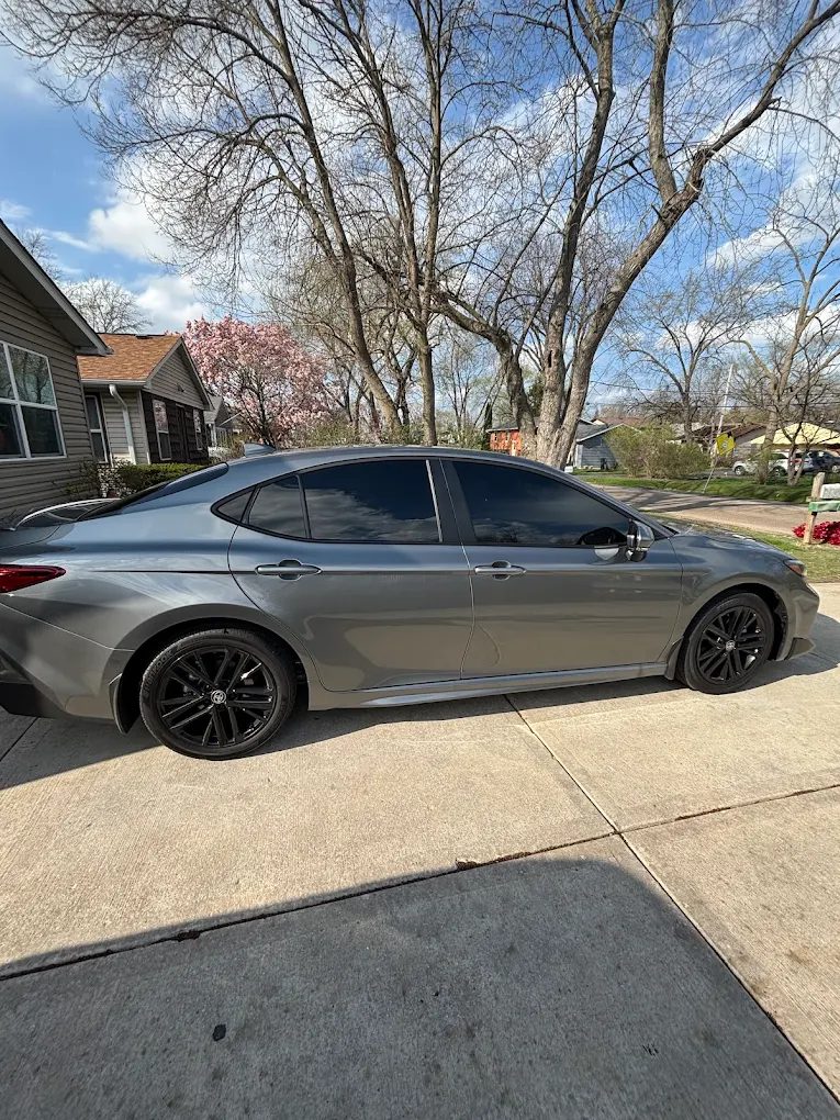 Grey Toyota Camry tinted side profile