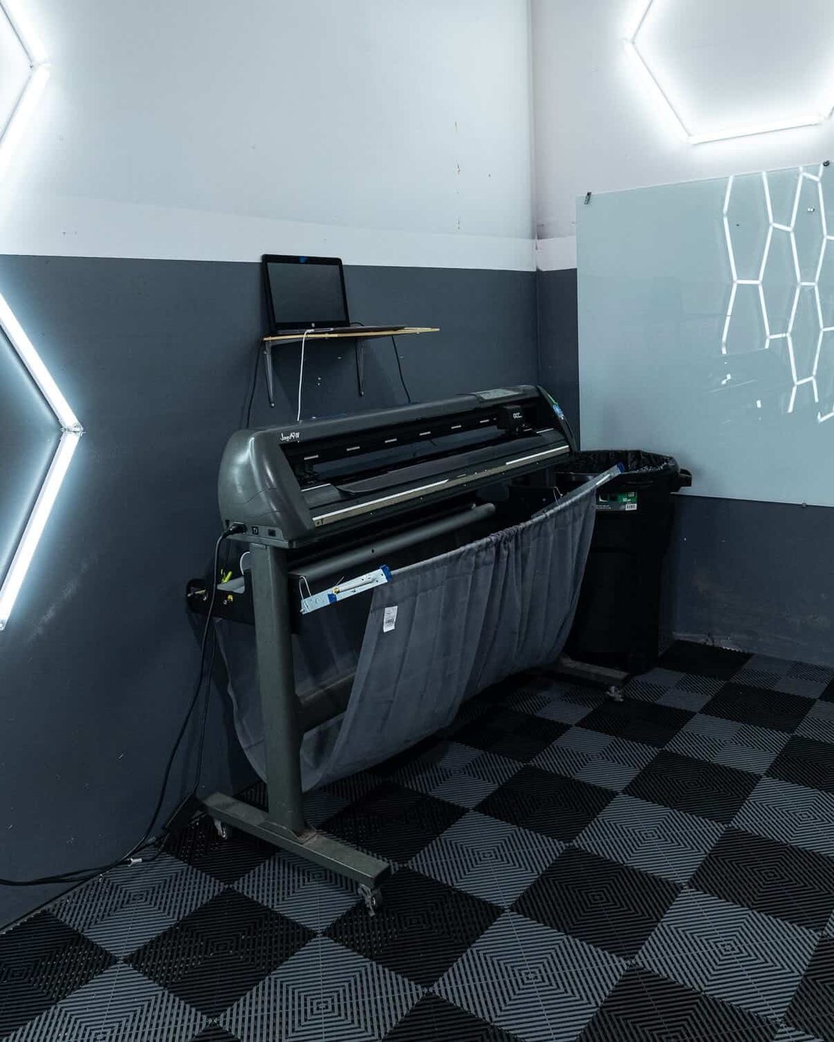 Plotter precision-cutting window tint film to vehicle patterns
